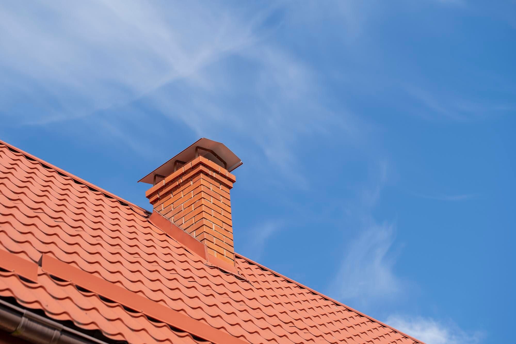 Restored brick chimney against a clear sky in Cleveland