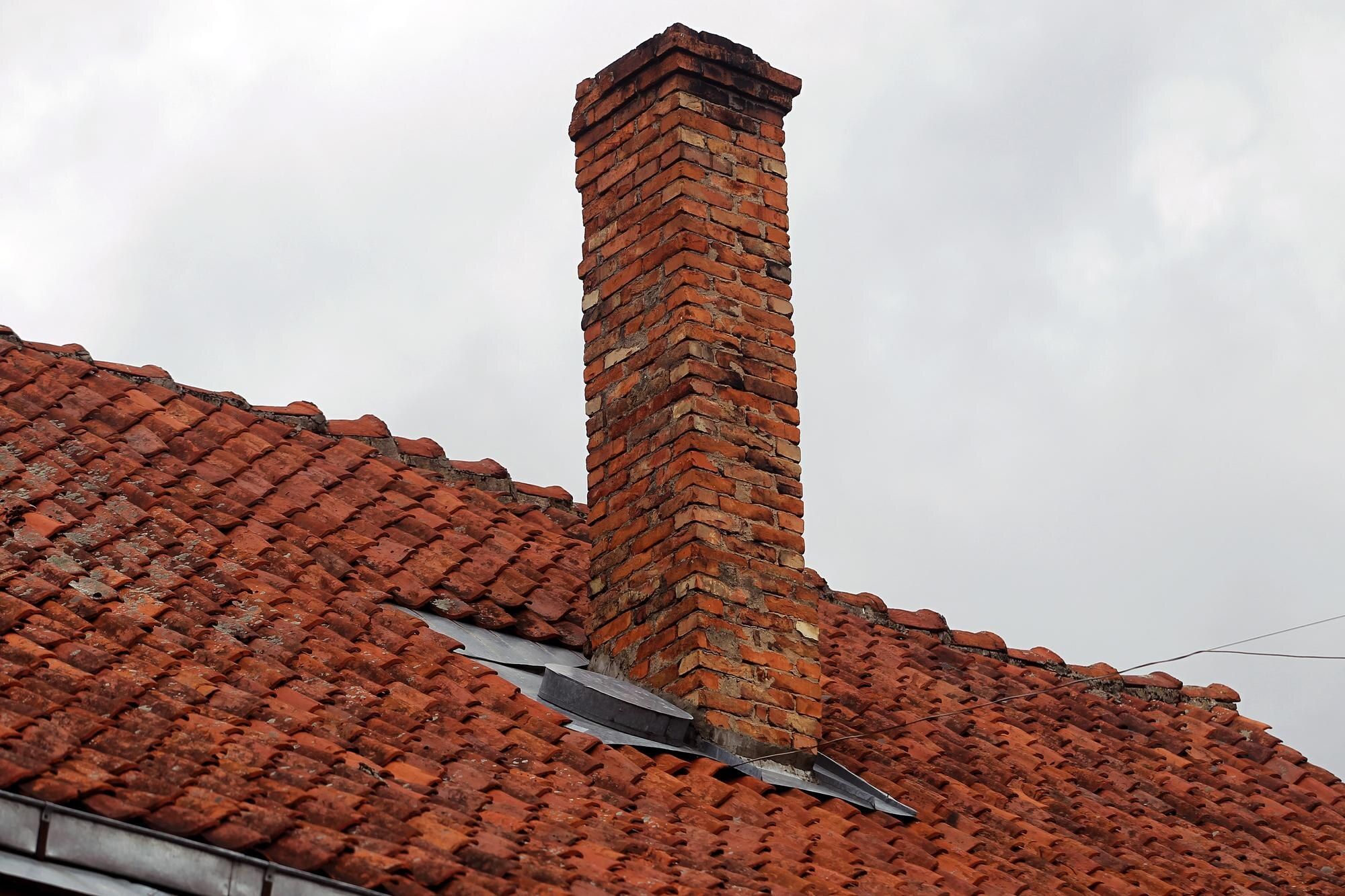 A brick chimney along the roofline of a Cleveland home